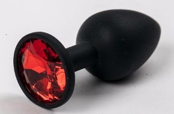Черная силиконовая анальная пробка с красным стразом - 7,1 см.