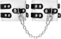 Бело-черные оковы с двумя ремешками и люверсами