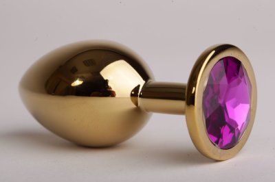 Золотистая анальная пробка с фиолетовым кристаллом - 9,5 см.  Цена 2 916 руб. Длина: 9.5 см. Диаметр: 4 см. Металлическая пробка с ограничительным основанием для безопасного использования. Страна: Китай. Материал: металл.