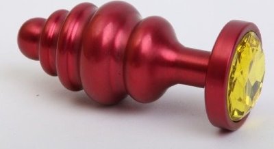 Красная ребристая анальная пробка с жёлтым стразом - 7,3 см.  Цена 1 385 руб. Длина: 7.3 см. Диаметр: 2.9 см. Металлическая анальная пробка с ограничительным основанием для безопасного использования и кристаллом. Страна: Китай. Материал: металл.