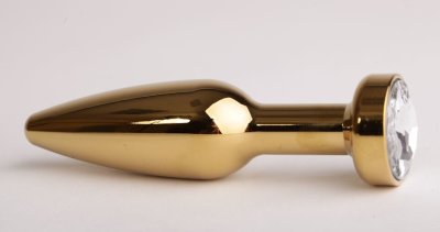 Золотистая анальная пробка с прозрачным кристаллом - 11,2 см.  Цена 2 484 руб. Длина: 11.2 см. Диаметр: 2.9 см. Металлическая пробка с ограничительным основанием для безопасного использования. Страна: Китай. Материал: металл.