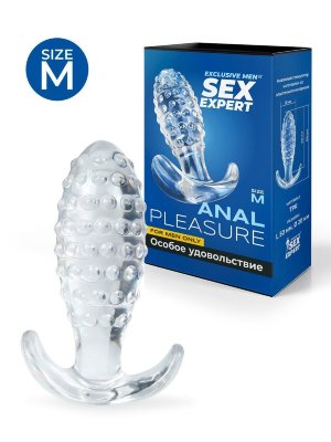 Прозрачная анальная пробка с шишечками - 8 см. Длина: 8 см. Диаметр: 2.5 см. Прозрачная втулка для любителей особых удовольствий. Используется для подготовки к анальному сексу или в качестве интимного аксессуара во время занятий любовью. Дарит чувство наполненности и незабываемые эротические ощущения. Выпуклости на поверхности втулки, соприкасаясь с стенками ануса, усиливают стимулирующий эффект. Изделие имеет эргономичную форму, способствующую лёгкому проникновению. Снабжено ручкой-ограничителем, которая позволяет контролировать глубину проникновения. Может использоваться для ношения. Секс-игрушка изготовлена из эластичного материала, дарящего приятные тактильные ощущения. Проста в использовании и уходе. Рабочая длина - 5 см. Страна: Китай. Материал: термопластичная резина (TPR).