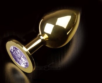 Большая золотая анальная пробка с закругленным кончиком и сиреневым кристаллом - 9 см.