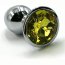 Серебристая алюминиевая анальная пробка с желтым кристаллом - 6 см.  Цена 756 руб. - Серебристая алюминиевая анальная пробка с желтым кристаллом - 6 см.