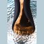 Чёрно-золотой клиторальный вибромассажер WANAME Surf  Цена 4 768 руб. - Чёрно-золотой клиторальный вибромассажер WANAME Surf